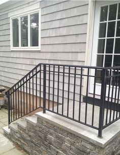 a metal railing on the side of a house