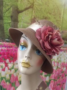 Gorgeous polypropylene hat - these hats are meant for special occasions mostly but it might be suitable for a few casual events as well. Brown hat with 2.75 inch brim with beige satin ribbon - mauve flower and little touches of feathers to add accent. One size fits up to 23.75 inches head circumference. Short Brim Top Hat For Kentucky Derby, Kentucky Derby Top Hat With Short Brim, Spring Party Fedora Panama Hat, Curved Brim Sun Hat For The Kentucky Derby, Brimmed Fedora For Kentucky Derby, One Size, Adjustable Curved Brim Costume Headpieces For Summer, Summer Brimmed Sun Hat For Church, Beige Top Hat With Flat Brim For Spring, Beige Fedora Straw Hat For Garden Party