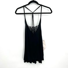 Brand: Urban Outfitters - Mouchette Style: Semi Sheer Lace Strappy Lightweight Tank Top **This Is A Sample Piece, So I'm Not Sure If This Went To Full Production. This May Be A Pretty Unique Piece. Size: Medium Color: Black Measurements When Laying Flat: Pit To Pit: 15" Length: 26" Condition: New With Tags! In Excellent Condition! Black Stretch Camisole For Night Out, Stretch Black Camisole For Night Out, Black Stretch Backless Camisole, Stretch Black Tops For Daywear, Black Stretch Camisole For The Beach, Black Stretch Camisole For Beach, Black Spaghetti Strap Loungewear Top, Black Summer Camisole For Loungewear, Stretch Lace Trim Tops For Date Night