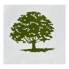 a paper cut out of a tree with birds flying around it and on the ground