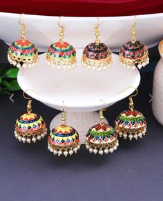 Indian Jewelry, Aesthetic Jhumka Earrings, Bridesmaid Proposal Welcome Bags Item, Wedding Party Favors, Wholesale Dholki, Mehndi, Haldi Gift Jhumki Earrings will come in mix colors. Great jewelry ornaments to wear for parties and family gatherings. Makes a wonderful gift for your loved ones on special occassion. These lovely statement pieces are perfect for wearing to the an event or showing your love for latest trendy fashion look. This is beautiful prop to include in your wedding day shoot. We have made it in our signature wedding colors, adding grace to the occasion. The best efforts have been made to take photos representing the true colors of the item, however colors may vary slightly due to different screen settings and devices. Visit House of Gifting Store for more stunning handcraf Multicolor Jhumkas For Diwali, Gift Danglers For Navratri, Multicolor Jhumkas With Latkans For Celebration, Multicolor Latkans Danglers For Diwali, Multicolor Danglers With Latkans For Diwali, Multicolor Tilla Danglers For Festivals, Handmade Multicolor Jhumkas For Festive Season, Multicolor Jhumkas For Navratri Party, Multicolor Jhumkas With Latkans