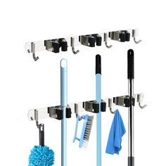 the rack is holding several different types of cleaning products and tools, including a mop, brush, and sponge