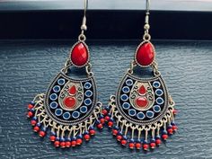 Boho Red Dangle Earrings, Indian Beaded Tassel Earrings, Antique Teardrop Earrings, Large Statement Earrings, Colorful Enameled Earrings, Bohemian Jewelry for Woman ❤️Boho your way! Thanks for stopping by! We have many unique items here, please take a moment to visit! -Your order will be shipped out within 2 business days after the order has been received. -These earrings are light weight and easy to wear, perfect for your daily look. -They're designed with different geometric shapes like circle, triangle, diamond, teardrop etc, they can show your personality in different styles. -These earrings are also perfect gifts for friends and families, the exquisite accessory for women.  -They fit all of your fashion needs, for any formal and informal occasions, such as party, vacation, prom, weddi Red Tassel Drop Earrings For Pierced Ears, Red Handmade Dangle Earrings, Red Handmade Dangle Danglers, Red Vintage Earrings For Festivals, Traditional Red Nickel-free Earrings, Traditional Nickel-free Red Earrings, Red Beaded Teardrop Dangle Earrings, Traditional Red Jewelry With Tassels, Red Teardrop Earrings For Festival