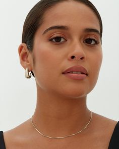 Unleash your style with our chunky dome hoop earrings, which are 23mm high, 10mm wide, and 14mm long. Embrace the perfect blend of style and quality for a statement-making look. Materials 14K yellow gold or white gold plated. s925 Sterling Silver Posts. Measurements: Height: 23mm; Width: 10mm; Length: 14mm. Hypoallergenic; nickel, lead, and cadmium free. Classic Chunky Jewelry As A Gift, Classic Chunky Jewelry As Gift, Classic Gold Chunky Jewelry, Classic Chunky Gold Jewelry, Chunky Hoop Jewelry, Chunky Small Hoop Jewelry, Classic Chunky Everyday Jewelry, Modern Chunky Jewelry For Everyday Wear, Minimalist Chunky Small Hoop Jewelry