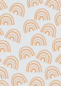 an orange and white wallpaper with rainbows on the back in pastel colors