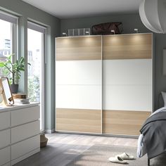 a bedroom scene with focus on the sliding closet doors and white shoes in the foreground