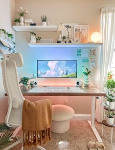 a desk with a computer on it and some plants in the corner next to it