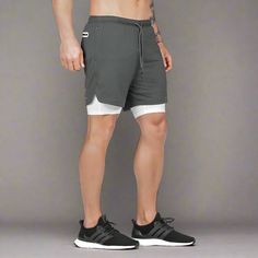 Elevate your workout game with our UltraFit Athletic Shorts. Engineered for peak performance, these shorts are designed to keep up with your active lifestyle. Crafted from high-quality, breathable fabric with moisture-wicking technology, they keep you cool and dry even during the most intense workouts. Featuring a comfortable elastic waistband and a streamlined fit, they offer freedom of movement and support where you need it most. Whether you're hitting the gym, going for a run, or practicing y Sportswear Athletic Shorts With Built-in Shorts For Running, Breathable Nylon Athletic Shorts For Workout, Gray Compression Athletic Shorts With Built-in Shorts, Breathable Gray Gym Bottoms, Black Compression Athletic Shorts For Light Sports, Breathable Sportswear Shorts For Light Sports, Sporty Moisture-wicking Shorts For Light Sports, Functional Go-dry Breathable Bottoms, Nylon Athletic Shorts For Light Sports