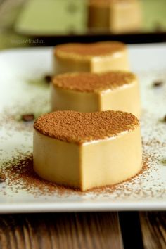 three pieces of cake sitting on top of a white plate