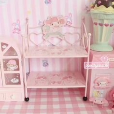 a pink dollhouse with furniture and accessories in it's room, including a bed