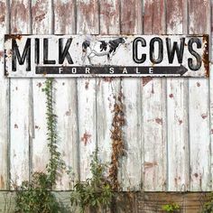 an old metal sign that says milk cows for sale