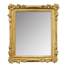 an ornate gold framed mirror against a white background