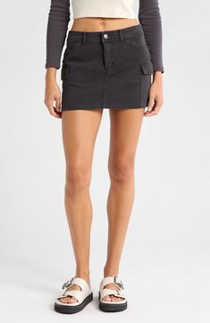 Cargo pockets lend on-trend utility vibes to this weekend-ready miniskirt made from sturdy cotton twill. 13" center front length (size Medium) Zip fly with button closure Front slant pockets; back patch pockets; cargo flap-patch pockets Unlined 100% cotton Machine wash, line dry Imported Trendy Mini Cargo Skirt In Cotton, Trendy Cotton Mini Cargo Skirt, Trendy Mini Length Cotton Cargo Skirt, Trendy Short Cotton Cargo Skirt, Mini Cotton Denim Skirt With Pockets, Cotton Denim Mini Skirt With Pockets, Utility Cotton Skort, Short Length, Utility Cotton Skort In Short Length, Utility Style Cotton Skort