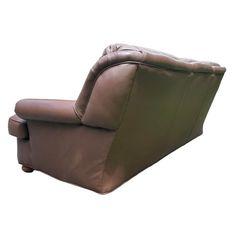 a brown reclining chair sitting on top of a white floor