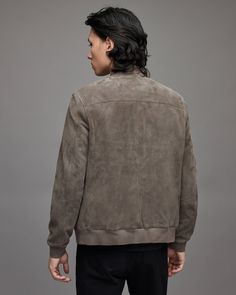 Men's Suede Leather Bomber Jacket In Gray Crafted from the finest leather, our men's gray suede bomber jacket is essential for your travels. Featuring classic lapels and a rib knit collar for a refined touch, this soft suede leather jacket will bring luxury to any formal occasion. Its two side pockets keep your hands free from your phone or keys, while its interior breast pocket ensures you have easy access to your wallet or phone as well. Wear it with your favourite jeans, or slacks for an ideal pair of menswear. Outer Shell: Real Leather Leather Type: Goatskin Leather Finish: Suede Inner Shell: Viscose Lining Closure Style: Zipper Collar Style: Band Rib Knit Cuffs Style: Rib Knit Inside Pockets: Two Outside Pockets: Two Side Pockets, One Breast Pocket Color: Gray Luxury Suede Leather Jacket For Fall, Luxury Suede Leather Jacket For Business, Business Suede Leather Jacket For Fall, Classic Leather Jacket With Suede Lining, Leather Jacket With Suede Lining For Fall, Fall Leather Jacket With Suede Lining, Casual Suede Outerwear For Business, Classic Winter Leather Jacket With Suede Overlays, Classic Leather Jacket With Suede Overlays For Winter