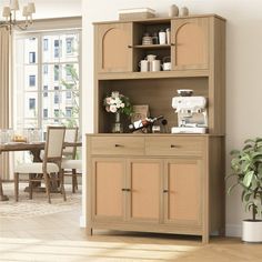 a wooden cabinet with wicker doors next to a dining room table