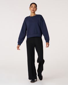 The scuba crewneck sweatshirt is designed with a relaxed fit and dropped shoulders, perfect for any casual activity. It is ideal for dressing down or layering up, whether paired with shorts or joggers. Features subtle embroidered logo and pleat on the back for an elevated piece. Layer this sweatshirt over a blouse and pair it with our pintuck wide leg pant for a professional look. Made from our luxurious scuba fabric, it is has a medium weight coverage and a drapey feel that is cooling and smoot Athleisure Sweats With Relaxed Fit For Elevated Casual, Sporty Drop Shoulder Sweatshirt With Ribbed Cuffs, Relaxed Fit Sweats For Elevated Casual Athleisure, Relaxed Fit Sweats For Elevated Casual, Athleisure Sweatshirt With Drop Shoulder, Boxy Fit Crew Neck Activewear In Athleisure Style, Athleisure Crew Sweatshirt With Ribbed Cuffs, Sporty Boxy Fit Crew Sweatshirt, Athleisure Sweatshirt With Drop Shoulder And Ribbed Cuffs