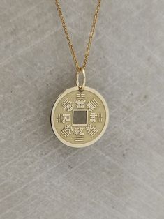 "Chinese Coin Necklace - Engraved Lucky Coin Charm - Gold Chinese Charm - Gold Feng Shui Pendant ▪️ A beautiful and clean engraved Chinese Coin pendant made out of 14K Solid Real Gold. Available only in yellow gold! Pendant Thickness: 0.50mm Jump Ring inner diameter: 4mm Dimensions: - 13mm / 0.52 inches - 15mm / 0.59 inches - 18mm / 0.70 inches - 20mm / 0.78 inches - 22mm / 0.86 inches - 24mm / 0.94 inches Necklace Length - You can choose your chain length from 35CM to 50CM. The pendant is avail Symbolic Coin Jewelry For Good Luck, Good Luck Coin-shaped Amulet Jewelry, Good Luck Coin Shaped Amulet Jewelry, Good Luck Coin Amulet Jewelry, Amulet Style Coin Necklace With Charms, Round Amulet Coin Necklace With Charms, Good Luck Symbolic Round Jewelry, Spiritual Coin Jewelry For Good Luck, Good Luck Engraved Round Pendant Necklace