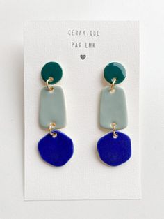 two tone earrings with blue and green accents