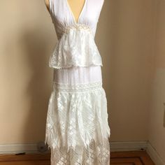 Foxiedox Ivory White Sleeveless Lace Ruffle Tiered Maxi Dress, Sz Small Gorgeous V Neck With Polka Dot Pattern. Each Tier On This Lacy Dress Trimmed With A Fluttery Chiffon Ruffle That Truly Captures The Romantic Vibe Of Your Special Day. A Sheer Skirt Lined And Beautiful Sheer Lace Upper Back. Looks Flirty And Modern. Back-Zip Closure. Polyester And Washable. Sleeveless Ruffled Maxi Dress For Daywear, Fitted Sleeveless Maxi Dress With Ruffle Hem, White V-neck Sleeveless Dress With Ruffles, Sleeveless Lace Maxi Dress With Ruffles, Sleeveless Ruffle Hem Maxi Dress For Wedding, Sleeveless Maxi Dress With Ruffle Hem For Wedding, Fitted White Sleeveless Maxi Dress, White Fitted Sleeveless Maxi Dress, Elegant White Tiered Maxi Dress