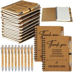 a note book, pen and notebook with thank you notes on the cover are sitting next to each other