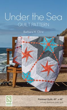 the cover of under the sea quilt pattern, featuring an image of a bench and ocean