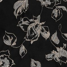 black and silver fabric with flowers on it