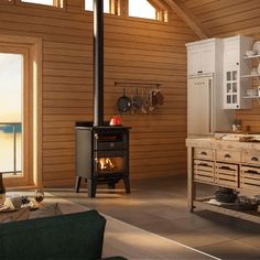 a kitchen with a stove, cabinets and windows in it's center area next to an open floor plan