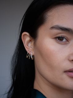 Style is in the details. Minimalist in size but maximalist in shine, the Mini Triangle Safety Pin Earring is crafted from 14Kt gold that gleams in the light. Make it your signature everyday piece. 14kt Gold Triangle Safety Pin Earring Available in Yellow or Rose Gold Width: Approx 5mm Length: 17mm Sold as single Made in L.A. Safety Pin Earring, 50th Clothing, Pin Earrings, Heel Accessories, Safety Pin Earrings, Gold Triangle, Sell Gold, Triangle Shape, Safety Pin