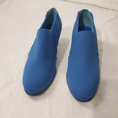 New In Box Woman's Size 7.5m Color Blue Stylish Blue Slip On With A 2 Inch Kitten Heel. Box C Blue Platform Heels In Synthetic Material, Blue Platform Boots With Pointed Toe, Blue Court Shoes With Medium Width And Round Toe, Blue Ankle-high Heels With 4-inch Heel, Blue Synthetic Boots With Round Toe, Blue Closed Toe Formal Boots, Formal Blue Closed Toe Boots, Blue Slip-on Office Heels, Blue Pointed Toe Heels With Stacked Heel