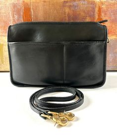 "It is a FABULOUS preowned COACH vintage New York City 1980's crossbody or clutch handbag Any question about the condition of my handbags just check out my 5 star reviews from previous buyers! Bag length 10.5\"  Bag height 7.5\" Bag depth 3\" Strap drop approx 24\" with brass lobster claw ends *  It has a zip top closure with a TALON brass zipper and leather zipper pull *  Main compartment is very clean with no damage, stains or odors *  The inside has a openslip pocket on the back wall and Coac Classic Handheld Clutch For Travel, Formal Crossbody Shoulder Bag With Zipper, Vintage Crossbody Clutch For Travel, Vintage Nyc, Black Handbag, Vintage New York, Leather Handbags Crossbody, Leather Conditioner, Coach Bag