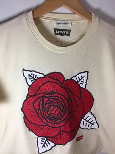 Levi's Graphic Flower Cropped Tee White Cotton T-shirt With Rose Print, Spring Cotton T-shirt With Rose Print, Spring Graphic Tee With Rose Print, Cotton Crew Neck Top With Rose Print, Spring Rose Print Graphic Tee, Cotton Graphic Tee With Rose Print, Casual Cotton T-shirt With Rose Print, White Cotton Tops With Rose Print, White Cotton Top With Rose Print