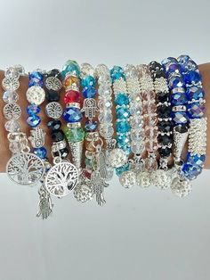 This are assorted charm bracelets made using  a stretching thread, beads and charms. The bracelets are marked with numbers for one to choose their preferred one in the next photo. The bracelets have a stretch thread hence can fit comfortable on any hand size. Shipping remains constant no matter the quantity of bracelets purchased.  Shipping is fast and only takes 3-7 days to ship worldwide Gift Crystal Bangle Bracelet With 8mm Beads, 8mm Beads Crystal Bangle Bracelet As Gift, Colorful Beaded Crystal Bangle Bracelet Gift, Crystal Bangle Bracelet With 8mm Beads As Gift, Colorful Beads Crystal Bangle Bracelet As Gift, Spiritual Beaded Bracelets With Charms As Gift, Spiritual Round Beads Charm Bracelet As Gift, Spiritual Faceted Crystal Bangle Bracelet, Spiritual Beaded Bracelets With Charms For Gift