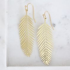 Brass Feather Leaf Earrings - Material: gold plated ear wire, brass leaf - Dimension: 50x18mm Elegant Gold Plated Leaf-shaped Earrings, Bohemian Leaf-shaped Pierced Earrings, Nature-inspired Leaf-shaped Earrings, Gold Leaf Nature-inspired Earrings, Elegant Leaf-shaped Brass Earrings, Celestial Necklace, Birthday Love, Jewelry Card, Accessories Rings