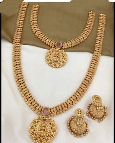 Traditional handcrafted gold plated Goddess temple necklace set from the house of the Lucentartsjewellery Shop. Its intricate  detailing with peacock motifs and studded ruby stones makes it look more royal and elegant. Adorned with matching attire, it will add brilliance and spark to the entire look. Perfect choice for weddings, parties, gifting, and other Indian festivals. Keep it in Zip Locks or Plastic Boxes. Dispatched within 7 working days. Keep the jewelry away from heat, water, sprays, an Handmade Gold Bridal Necklace, Handmade Gold Round Bridal Necklace, Handmade Round Gold Bridal Necklace, Traditional Gold Necklace For Marriage, Gold Bridal Necklace With Intricate Design As Gift, Gold Jewelry Sets As Gift With Intricate Design, Gold Plated Jewelry Sets For Marriage, Handmade Yellow Gold Bridal Necklace For Wedding, Handmade Gold Necklaces For Wedding