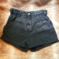 These Are A Pair Of Black Shorts Perfect For Summer. It Says Size Large But I Don't Believe It Is I'd Say It Fit A S-M Better. It Has A Cinched Waist And Pockets In The Front And Back. The Button And Zipper Work Well And It Has No Flaws As It Hasn't Been Worn Measurements: W:13" Length From Top To Bottom: 12" Black High Rise Bottoms With Elastic Waistband, Black High Waist Summer Bottoms, High Waist Black Bottoms For Summer, Black High Rise Summer Pants, High Waist Shorts With Elastic Waistband, Black High-waisted Shorts With Elastic Waistband, Black Relaxed Fit High-waisted Shorts, Casual High Waist Black Shorts, Super High Waisted Jeans