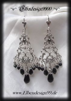 A very elegant pair of earrings in gothic style, which, like all my jewelry, was made with great care and attention to detail. The earrings were made from silver-plated metal ornaments and black glass beads. Black diamond rhinestones were also used. The pendants have a length of approx. 8 cm including the earwires. Victorian Chandeliers, Witch Goddess, Victorian Chandelier, Metal Ornaments, Pagan Witch, Gothic Earrings, Metal Ornament, Gothic Style, Czech Glass Beads