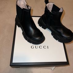 Gucci Kids Logo Detailed Chelsea Boots. This Black Leather Chunky Boot Is A Unisex Boot. They’re A Size 30eu Or 13us. They Are Gently Worn. They Come With Original Box + Dust-Bag. I’m Willing To Send Mire Pictures. Gucci Chelsea Boot, Chelsea Boots Black, Shoes Gucci, Gucci Kids, Black Chelsea Boots, Kids Logo, Chunky Boots, Gucci Black, Gucci Shoes