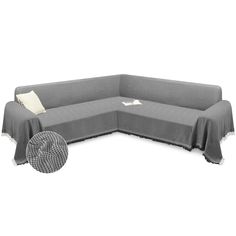 a gray couch with a white pillow on it