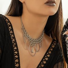 Description:Gothic Layered Moon Phase Pendant Chain Tassel Collar Choker NecklaceSpecification:Size: 13.7" + 2.7" extWeight: 1.44 oz/pcsMaterial: alloy metalChain colors: silverFeatures & Details:This gothic chain tassel collar choker necklace is made of nickel-free. lead-free. cadmium-free and hypoallergenic materials. which will not turn your skin green or cause anaphylactic reaction.It is easy to match your different outfits and also suitable for any occasions like wedding. banquet. costume p Halloween Metal Necklace With Adjustable Chain, Gothic Metal Dangle Necklaces, Gothic Alloy Choker Necklace, Metal Jewelry For Halloween Festival, Bohemian Metal Clavicle Chain Necklace, Metal Halloween Jewelry, Metal Halloween Festival Jewelry, Gothic Clavicle Chain Necklace In Alloy, Gothic Alloy Clavicle Chain Necklace