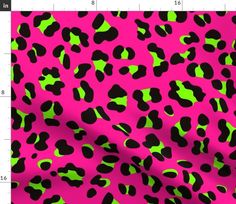 pink and green leopard print background with black spots on the bottom, in an abstract manner