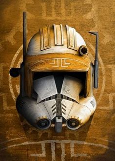 a star wars poster with a helmet on it's face and two swords in his mouth