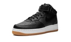 The Nike Air Force 1 Mid LX “Black/Gum" is a casual, mostly black colorway of the classic sneaker.  The versatile “Black/Gum” Air Force 1 Mid LX features a smooth black leather base with tonal textured leather overlays and Swoosh branding on either side.  The adjustable ankle strap appears in black leather, as well, and features a tonal “Nike Air” logo on the side.  Underfoot, the white rubber midsole with “Air” branding on the lateral side is paired with a gum outsole. Nike Air Logo, Gum Shoes, Air Logo, Nike Air Force 1 Mid, Air Force 1 Mid, Black Gums, Stadium Goods, Classic Sneakers, Nike Air Force 1