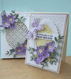 two cards with purple flowers on them, one has a heart shaped card and the other is