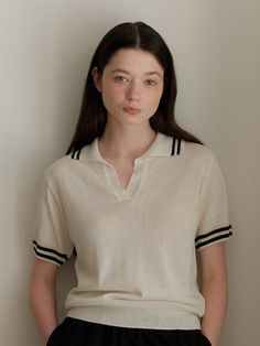 Casual knit sweater that made of lightweight fabric for summer. Featuring the natural V-neckline with open-collar, striped trim at collar and sleeve hems, and loose silhouette. Style with trousers, denim jeans, or skirts to create daily looks. - Open-collar and V-neckline design- Striped trim at collar and sleeve hems- Ribbed trim at collar, sleeve hems, and hem- Relaxed silhouette and standard length- Lightweight and cool fabric for hot summer Top With Collar Outfit, Classic V-neck Top With Striped Collar, V-neck Tops With Contrast Stripes For Spring, Summer Striped Collar V-neck Top, Summer V-neck Tops With Striped Collar, Summer V-neck Top With Striped Collar, Beige Top With Striped Collar For Spring, Beige Spring Top With Striped Collar, Summer Workwear Tops With Striped Cuffs