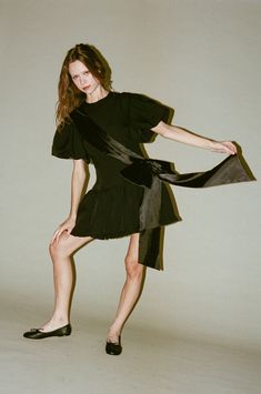 Sandy Liang Filenes Dress in Black - Short sleeve mini dress - Featuring a sash with rosette bow detail at front - Ruffle detail at hem - Made in NYC - Measurements: 2: Length- 32, Chest- 33.5, Waist- 28.3/4, 4: Length- 32, Chest- 34.5, Waist- 29.3/4, 6: Length- 32.1/4, Chest- 35.5, Waist- 30.3/4 Short Loungewear, Sandy Liang, Short Sleeve Mini Dress, Jumpsuit Shorts Rompers, Knitwear Tops, Short Rompers, Mini Dress With Sleeves, Bow Detail, Black Shorts