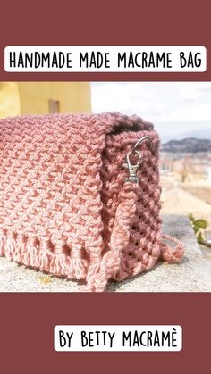 a pink crocheted bag with the words handmade made macrame bag