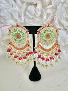 "Mint Green Meenakari Earrings and Tikka Set If you're looking for a jewelry set to wear to an upcoming Indian event, look no further - with handpainted details and pearl accents, this traditional mint green meenakari earring and tikka set has our heart!  These earrings are perfect for Indian weddings and festivities (I would wear these to a sangeet party). These also make for a pretty & memorable gift for special occasions! Details: 1 pair of hand-painted meenakari earrings 1 matching tikka  Shop more of our Indian Earrings here: https://www.etsy.com/shop/jazzyandco?section_id=23690892 What is Meenakari? Meenakari is a Persian art of colouring the surface of metals by fusing brilliant colours. The art was brought to India by Persian enamellists around the early 17th century. Mina is the f Cheap Meenakari Jewelry For Festive Occasions, Affordable Meenakari Jewelry For Festive Season, Luxury Meenakari Party Sets, Luxury Designer Meenakari Jewelry, Cheap Traditional Meenakari Earrings, Festive Meenakari Jewelry, Festive Fusion Bridal Earrings With Meenakari, White Meenakari Fusion Jhumkas, Fusion Style Meenakari Danglers For Celebration