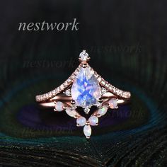 The moonstone ring: This ring is handmade, The metal is 14K rose gold. (If you would like 18K gold, pls contact me) The main stone is 6x8mm pear cut natural moonstone The Accent stones are moissanite The matching band: This ring is handmade, The metal is 14K rose gold. (If you would like 18K gold, pls contact me) The stone are opal I can make any jewelry.Contact me if you have something in mind,I'll make it come true! The jewelry can be rings,bands,pendants,necklace,bracelet,bangles,earrings... Rose Gold Moonstone Ring With Rose Cut Diamonds, Handmade Rose Gold Moonstone Wedding Ring, Handmade Rose Gold Moonstone Ring For Wedding, Celestial Rose Gold Moonstone Ring For Weddings, Celestial Rose Gold Moonstone Wedding Ring, Handmade Rose Gold Moonstone Ring For Anniversary, Rose Gold Celestial Moonstone Ring For Anniversary, Celestial Rose Gold Moonstone Ring For Anniversary, Moonstone Engagement Ring Set