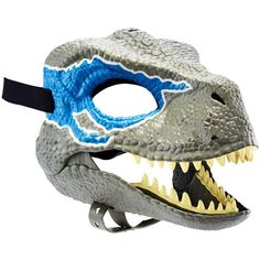 a dinosaur mask with blue and white teeth